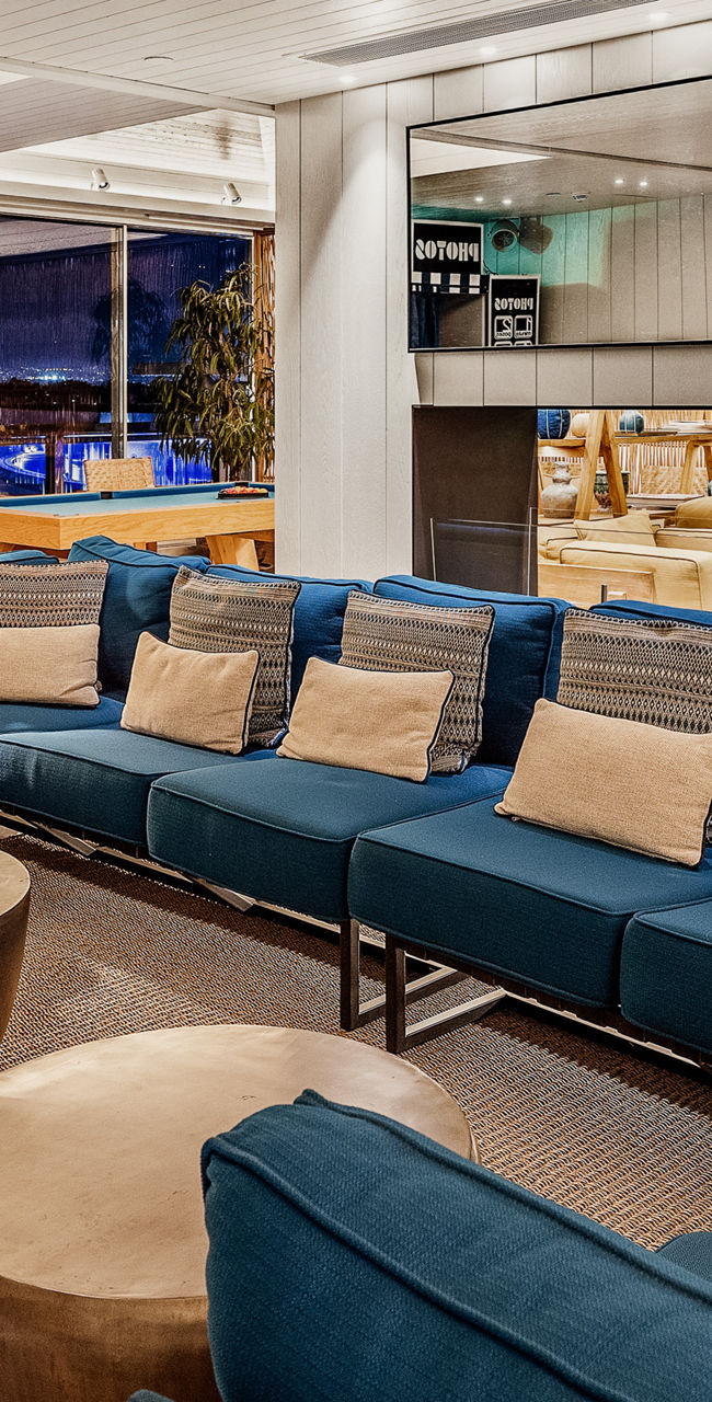 Modern lounge with blue seating and decor