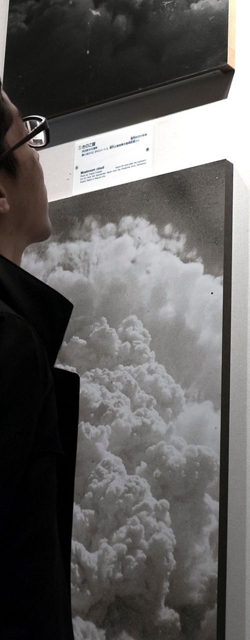 Visitor Observes Historic Black and White Photographs