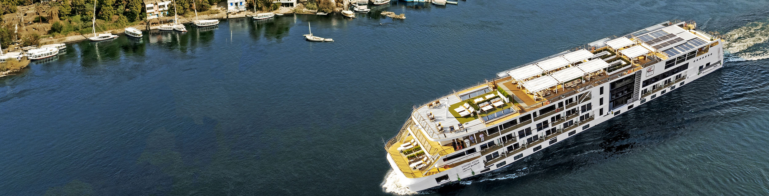 Luxury cruise ship on scenic river