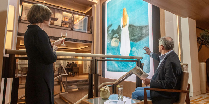 Couple admiring modern art in gallery