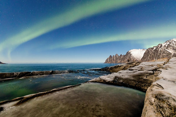 Northern Lights Over Arctic Coastline