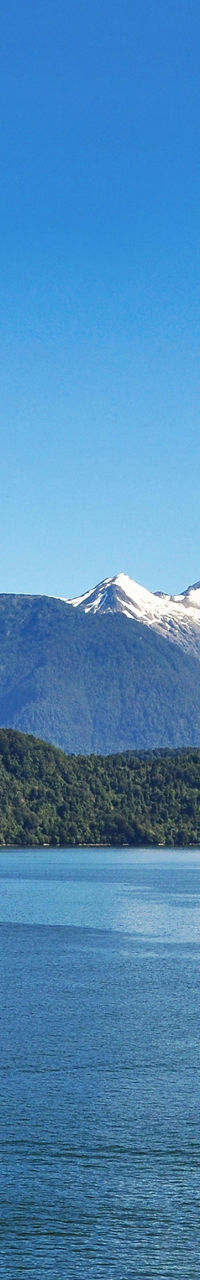 Scenic lake with snow-capped mountains