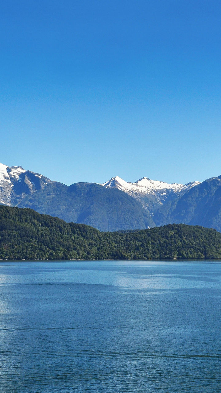 Scenic lake with snow-capped mountains