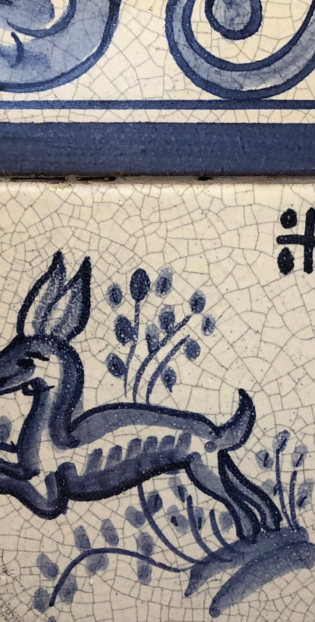 Blue and white ceramic tile with floral design