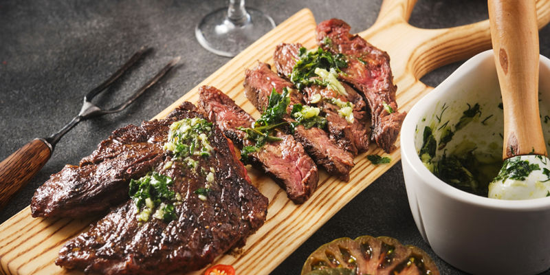 Grilled steak slices with herb butter