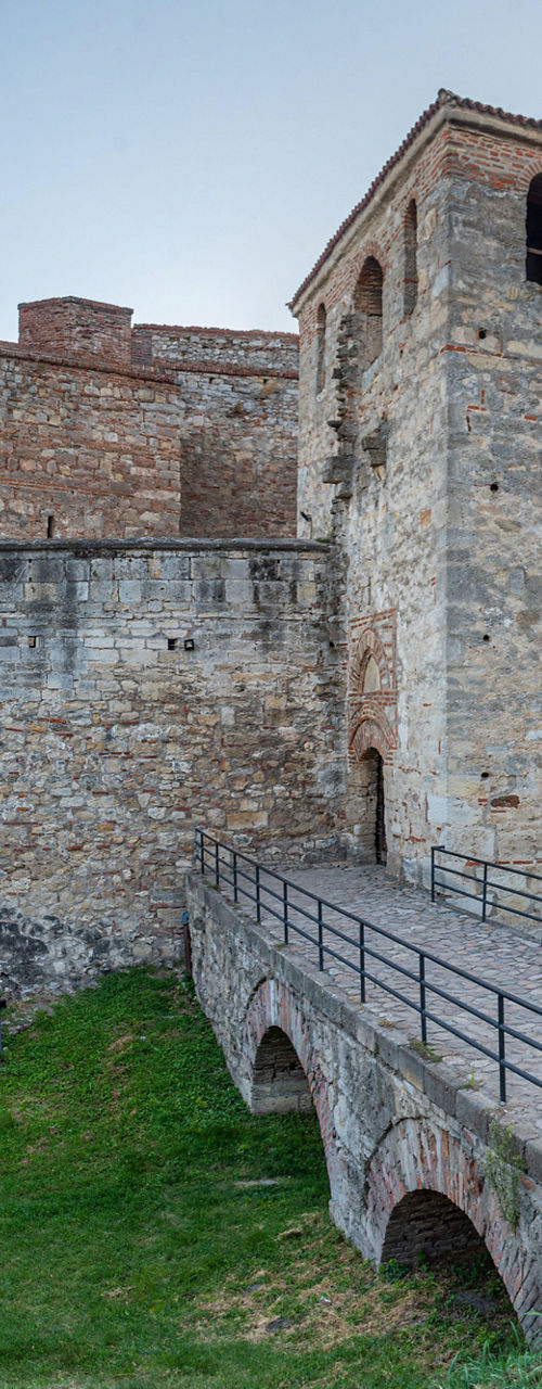 Historic stone fortress with bridge entry