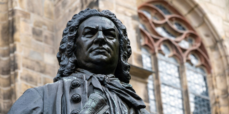 Historic statue near Gothic-style building