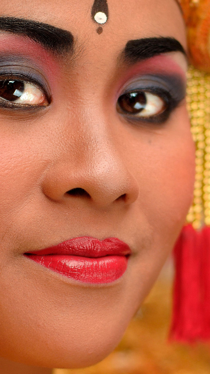 Traditional gold jewelry with red accents