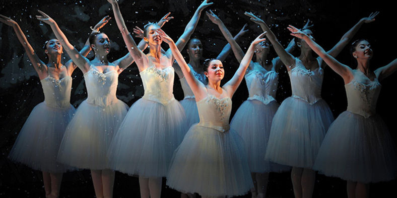 Ballet dancers in elegant white costumes
