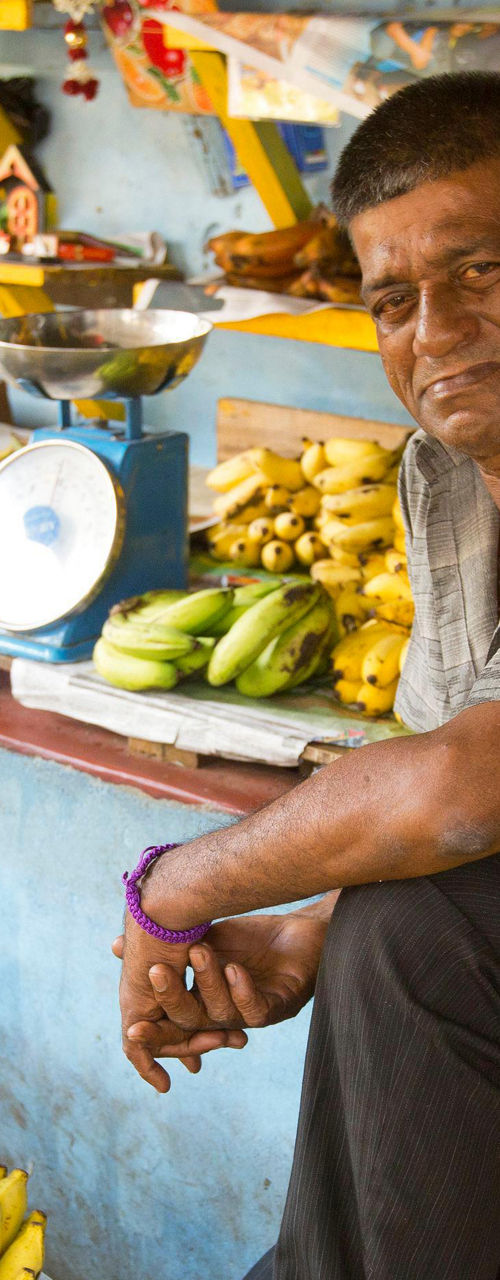 Banana vendor at local market stall
