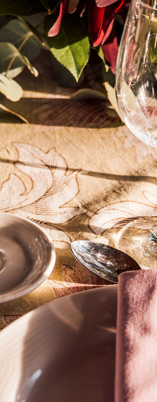 Elegant Table Setting with Glassware and Floral Centerpiece