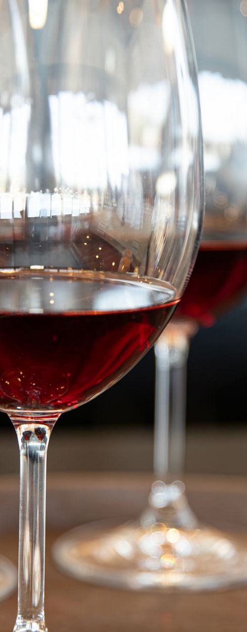 Three glasses of red wine on tray