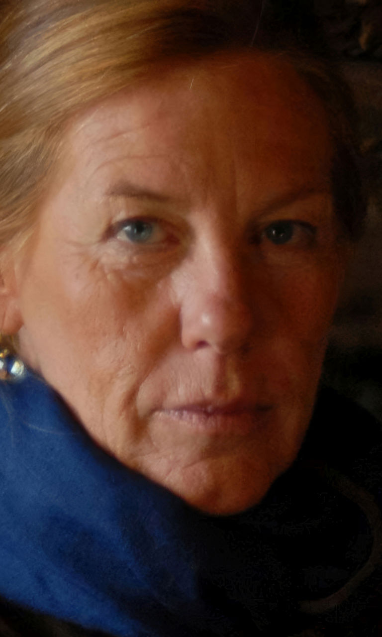 Woman in rustic setting with blue scarf