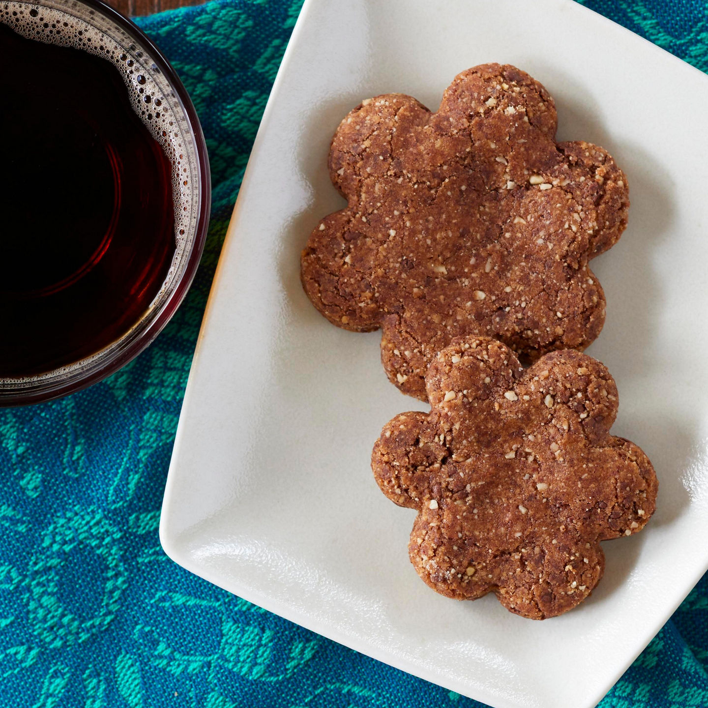 Flower-shaped cookies with coffee cups