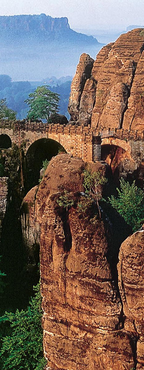 Historic stone bridge in scenic mountain landscape