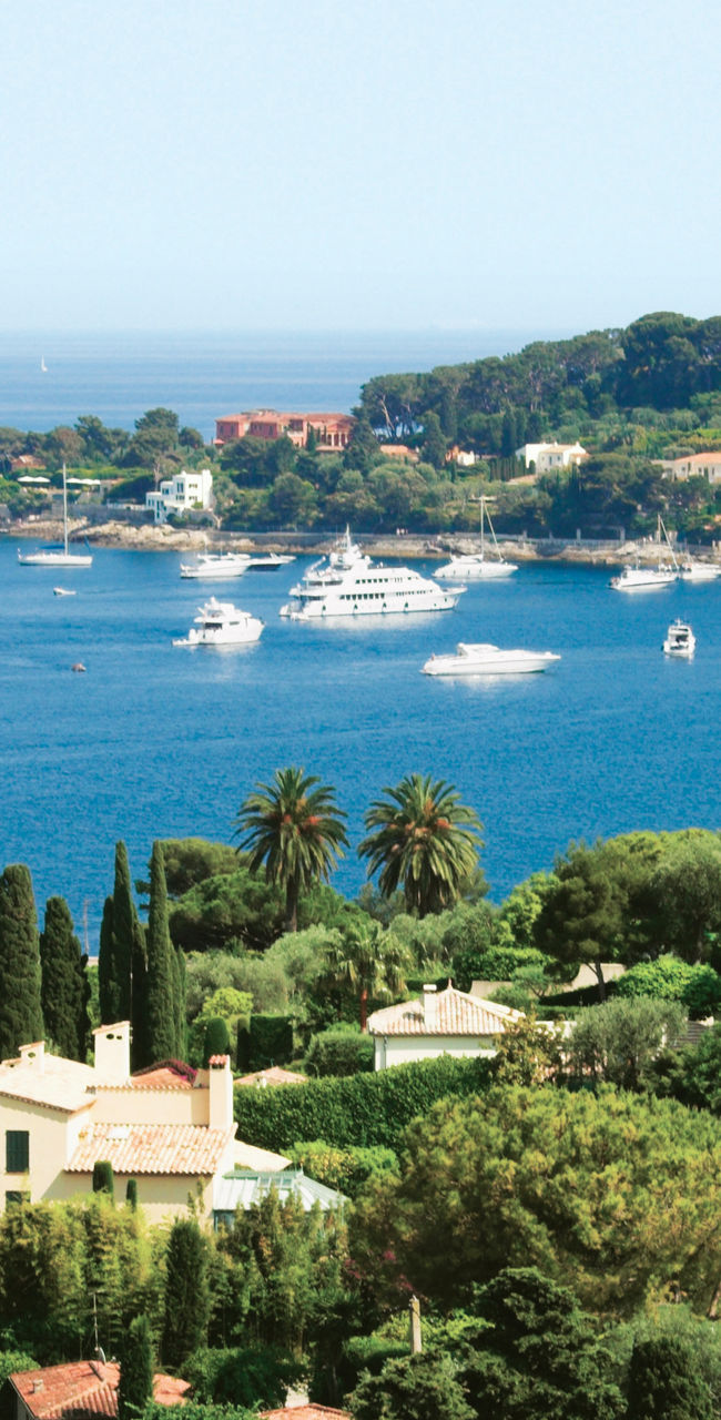 Scenic coastal view with luxury yachts