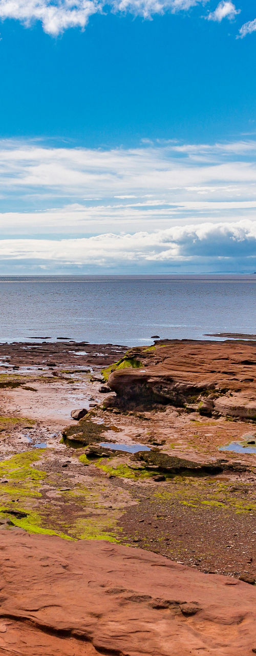 Scenic rocky shoreline with vibrant sky