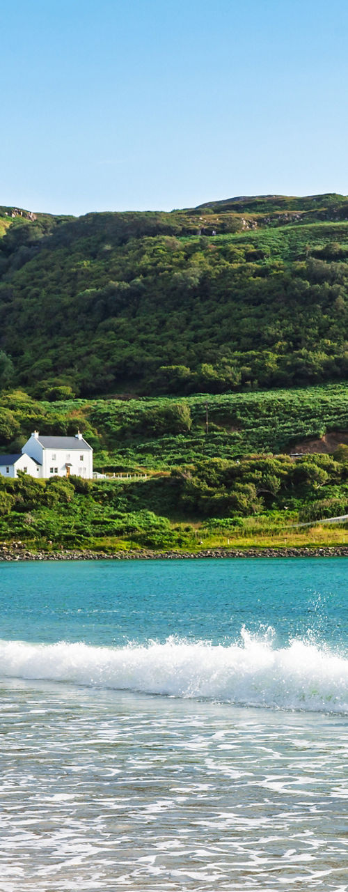 Sunny coastal bay with gentle waves