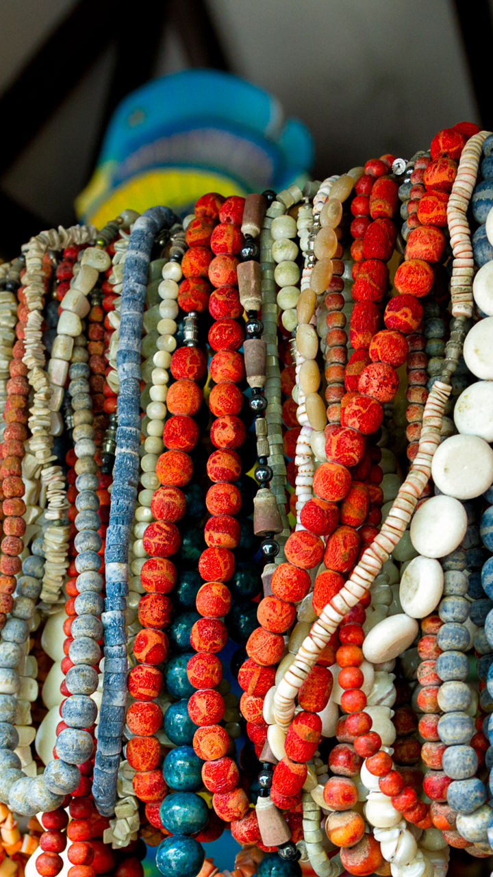 Colorful bead necklaces on display rack