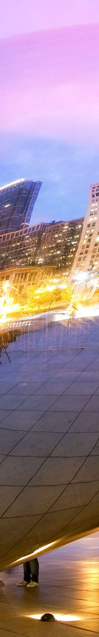 Cloud Gate sculpture reflecting city skyline