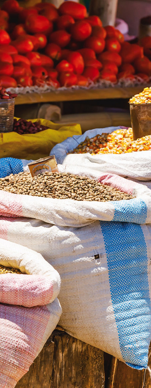 Colorful sacks of spices at outdoor market