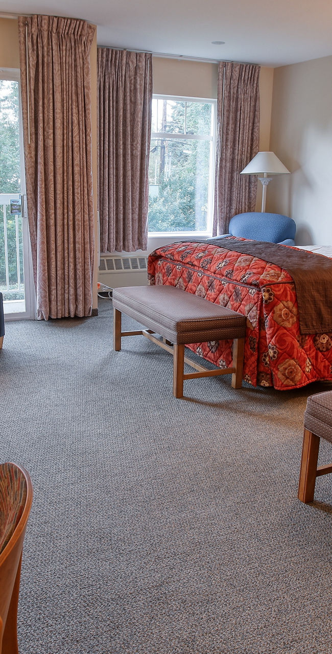 Cozy hotel room with double beds and balcony