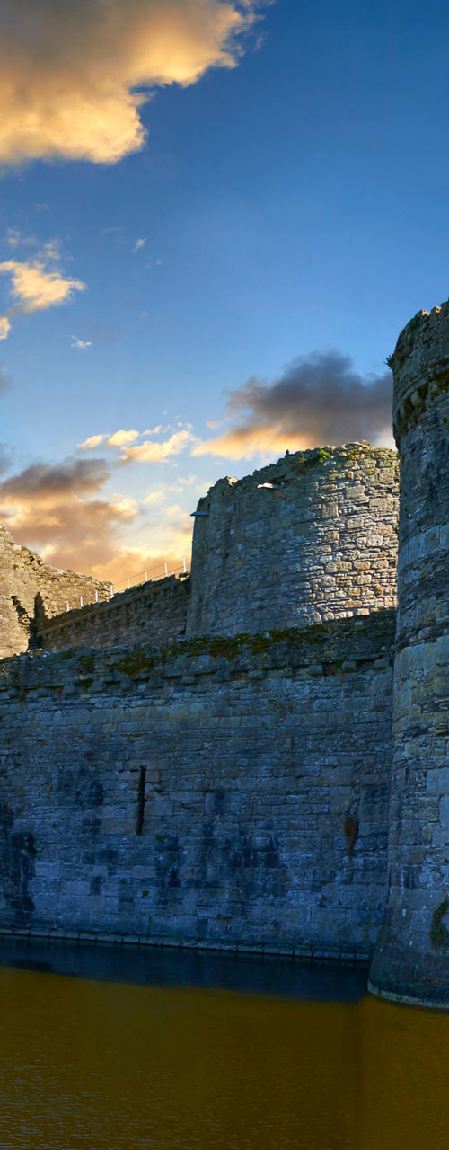 Historic stone castle surrounded by water