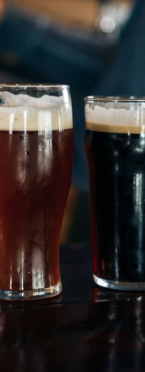 Four craft beers on wooden bar counter