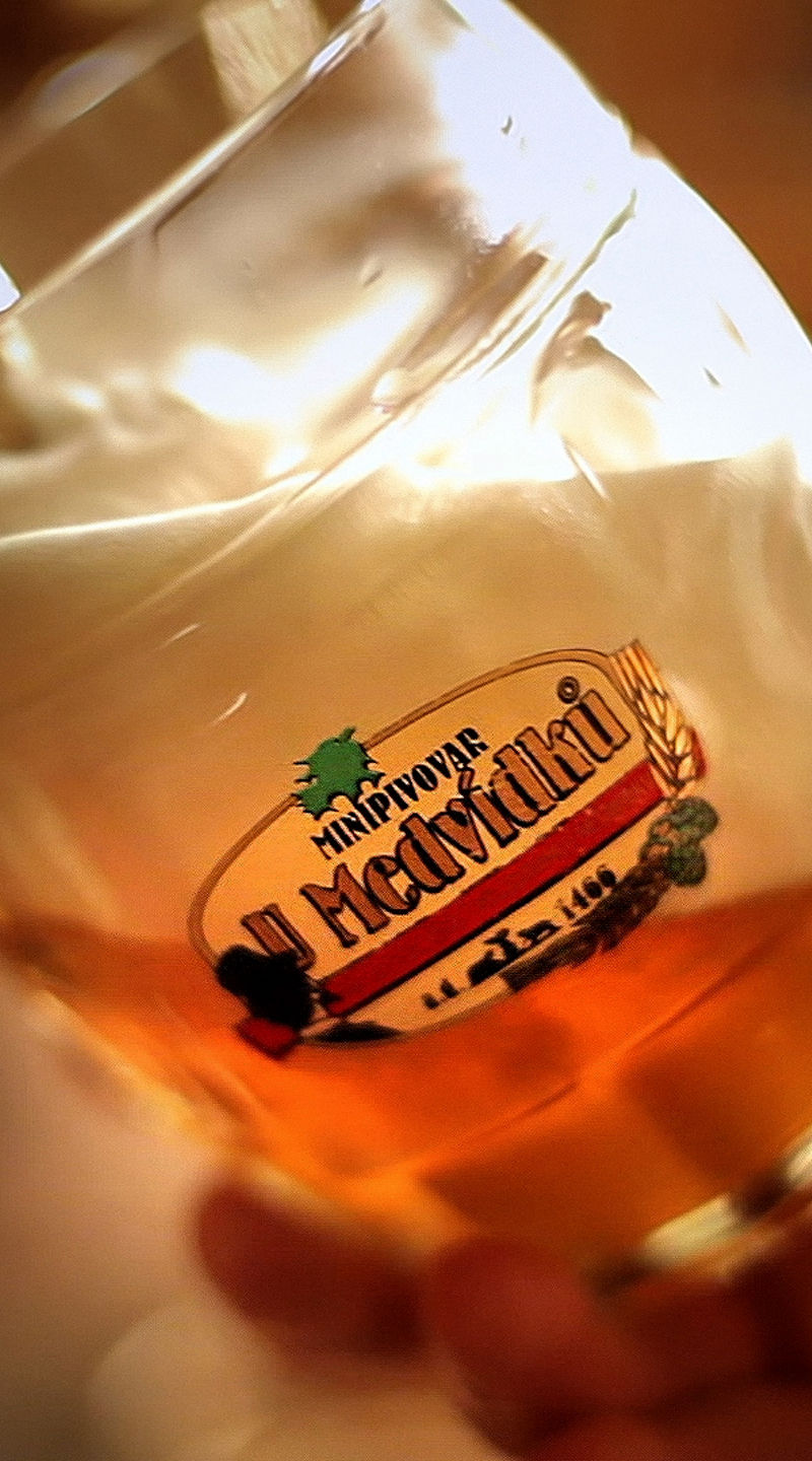 Beer poured into branded glass