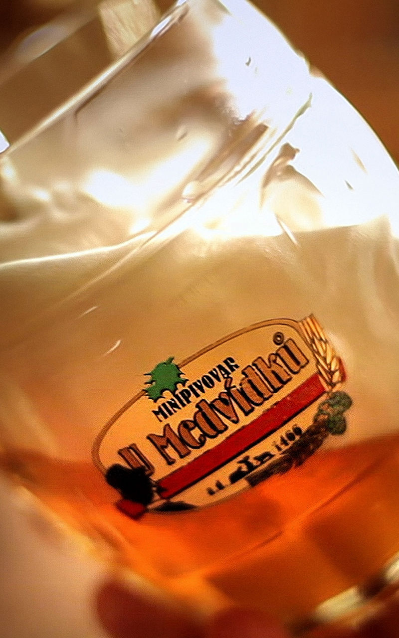 Beer poured into branded glass