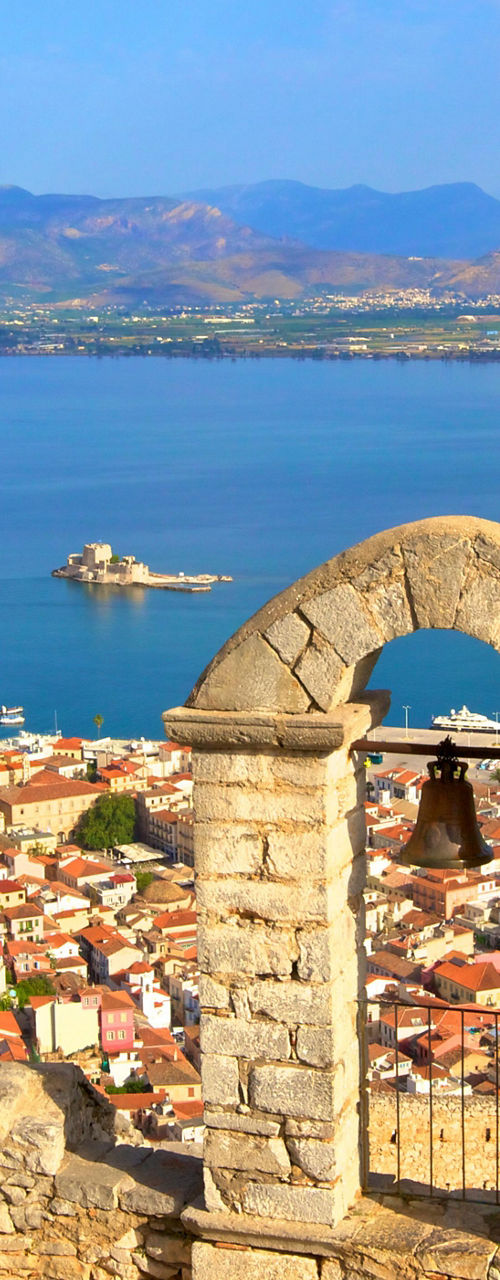 Scenic coastal view with historic arch