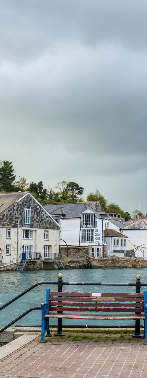 Scenic waterfront town with cloudy skies