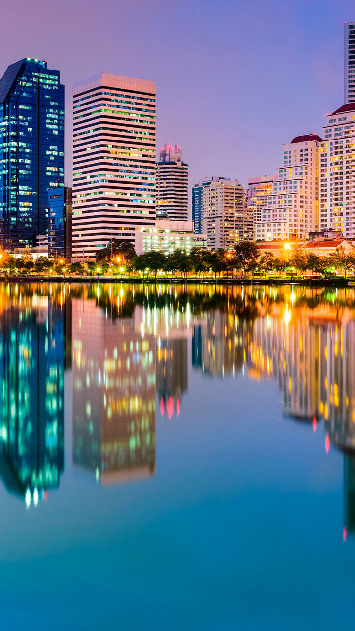 City skyline reflected in tranquil lake