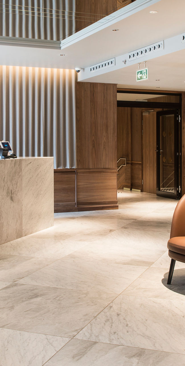 Modern hotel lobby with marble reception desk