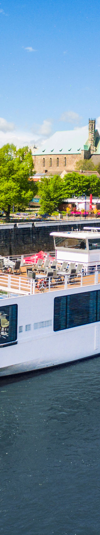 Viking river cruise ship on scenic waterway
