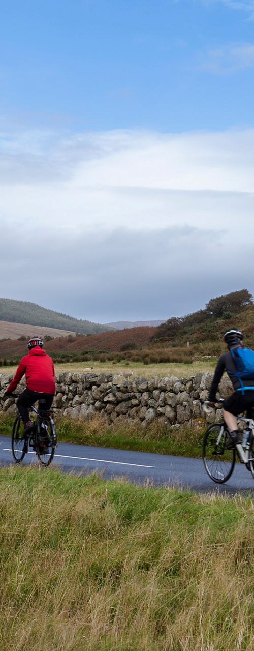 Group cycling through scenic countryside