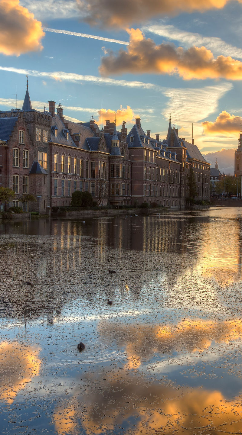 Historic building at sunset with reflection