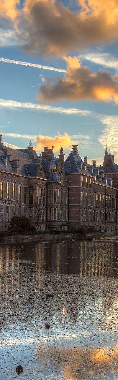 Historic building at sunset with reflection