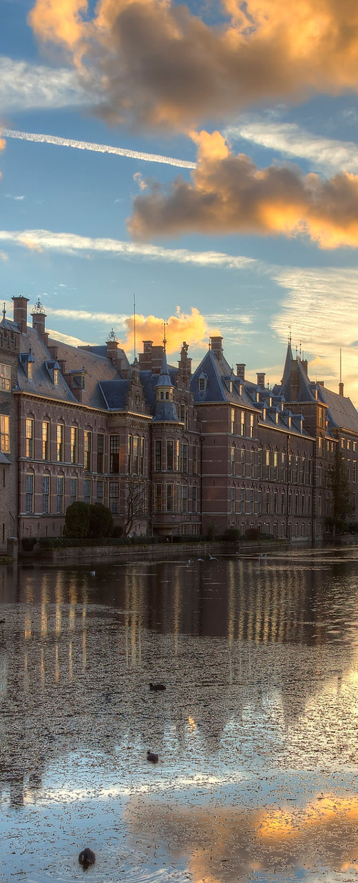 Historic building at sunset with reflection