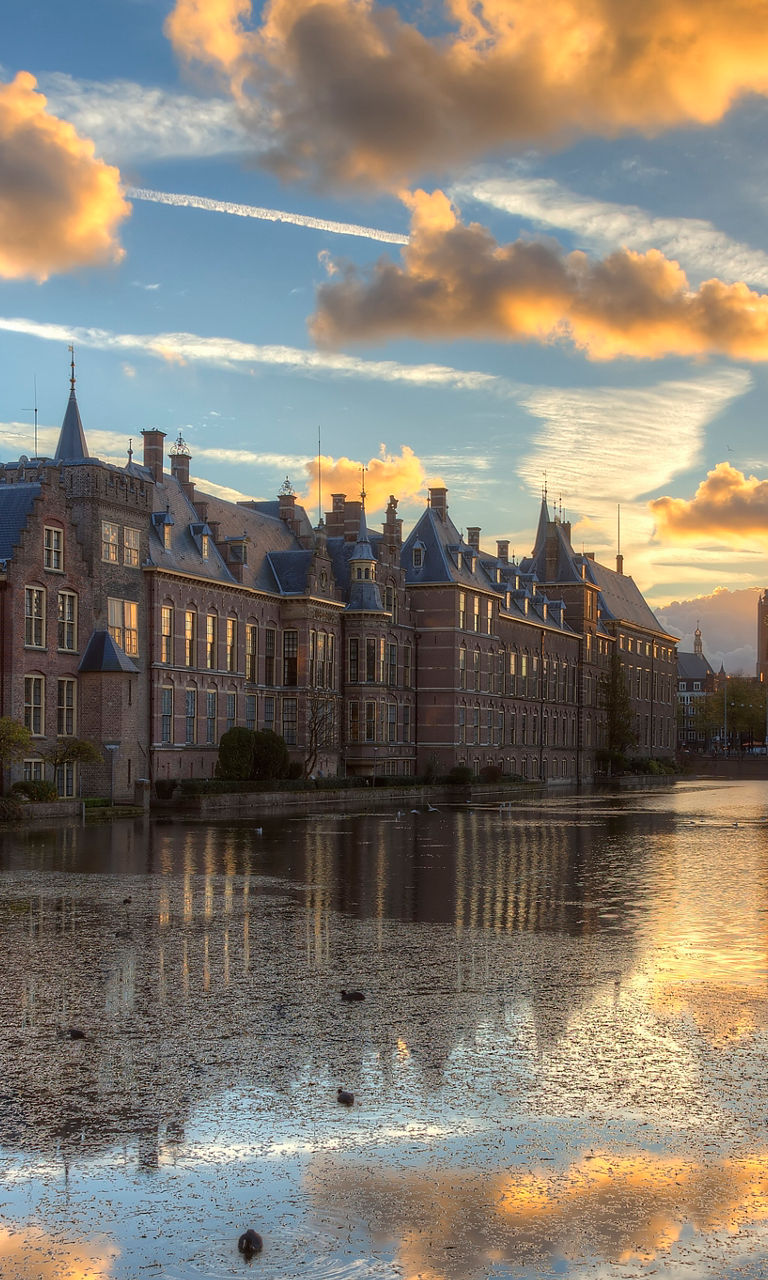 Historic building at sunset with reflection