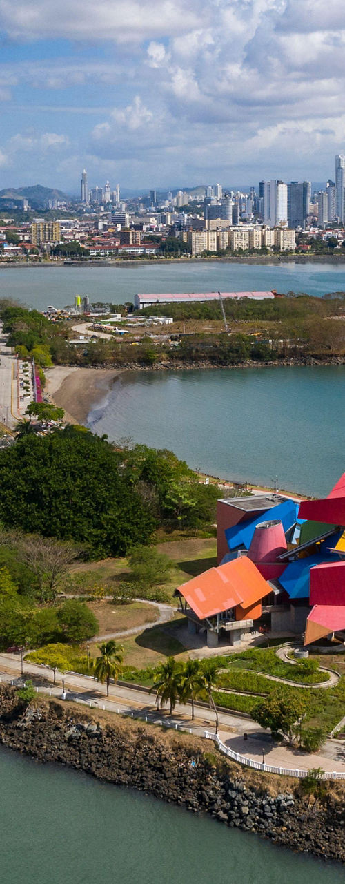 Colorful museum near Panama City skyline