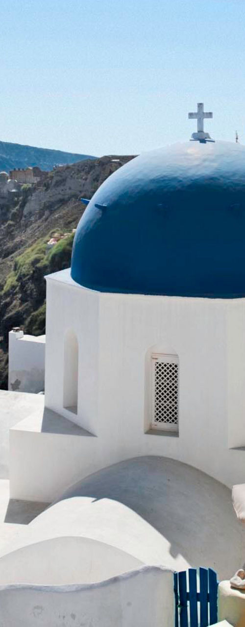 Santorini blue domes overlooking the Aegean Sea