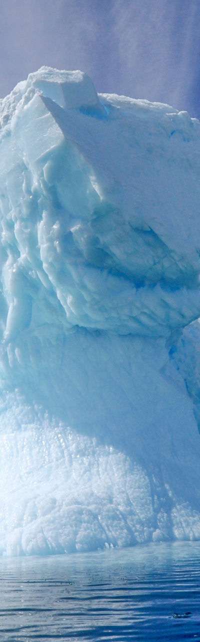 Majestic iceberg under vibrant sky