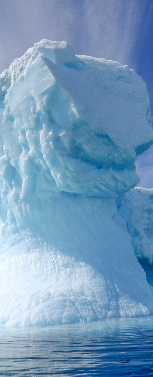 Majestic iceberg under vibrant sky