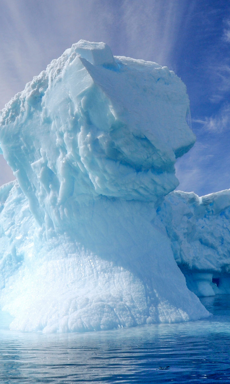 Majestic iceberg under vibrant sky