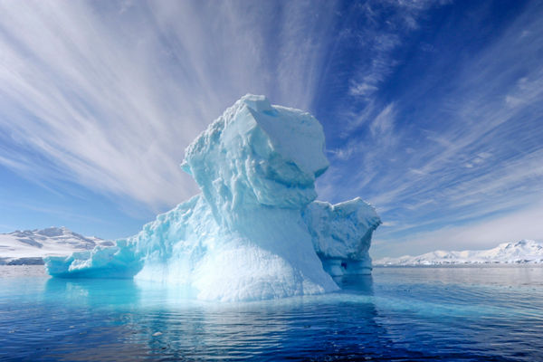 Majestic iceberg under vibrant sky