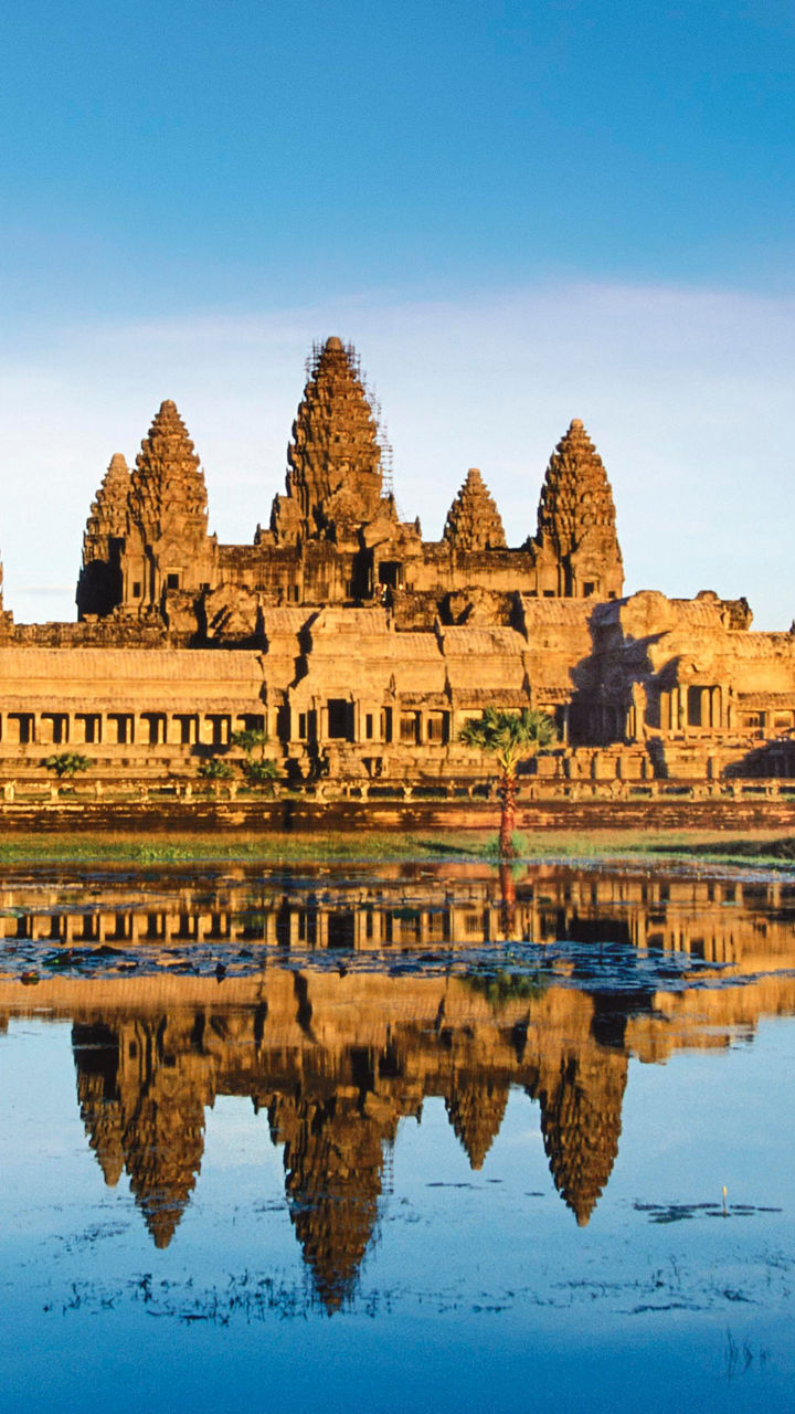 Angkor Wat temple with reflection at sunrise