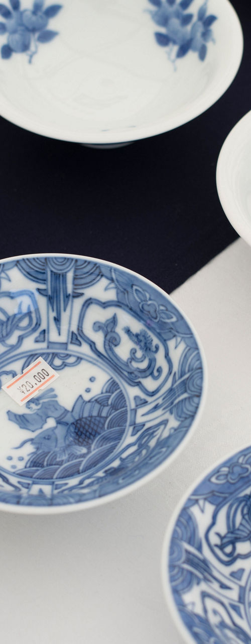 Blue and white ceramic bowls on display