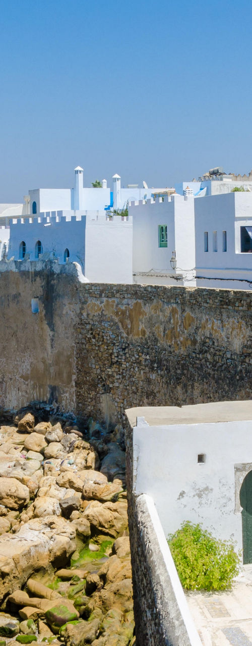 White coastal town with rocky shoreline