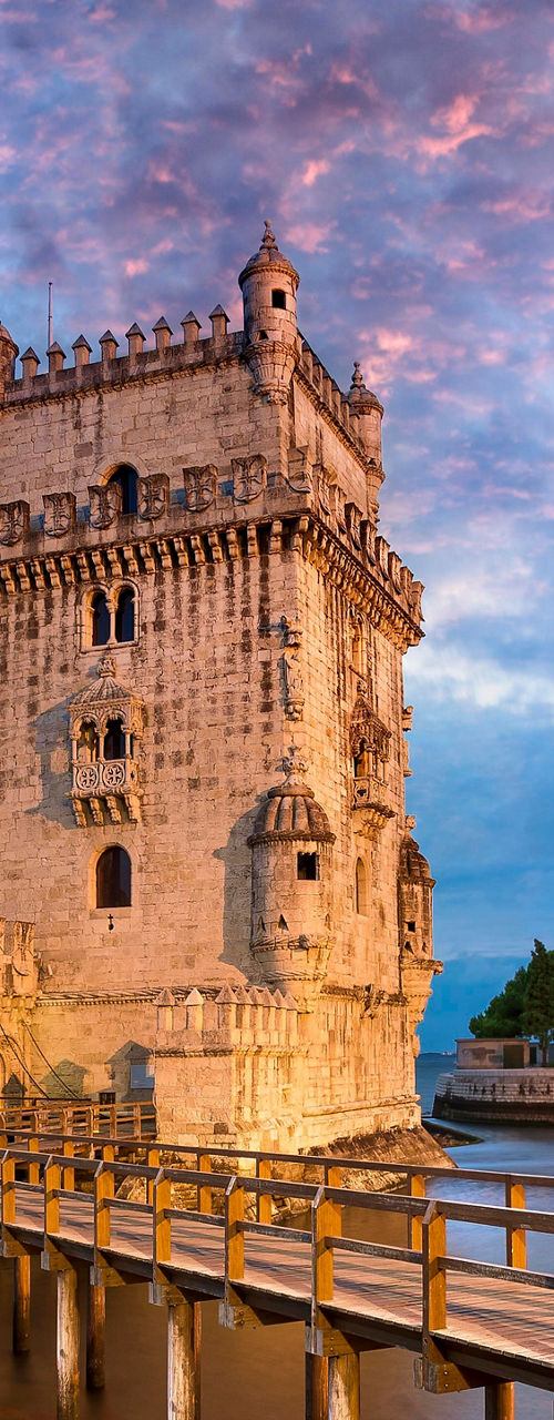 Belem Tower at sunset with reflection